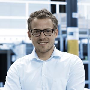 Logistics manager works with warehouse management software viadat 