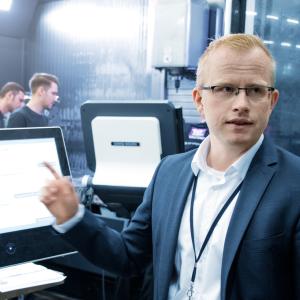 Top manager works with warehouse management software viadat 