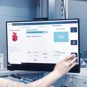 Warehouse employee operates screen with viadat warehouse management system from viastore