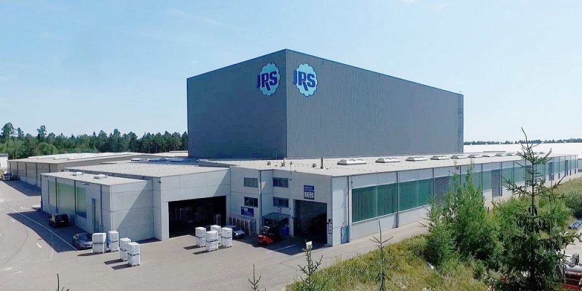 Frontal view of Rettenmaier's logistics center, viastore high-bay warehouse in the center