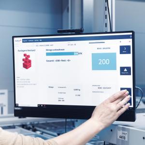 Warehouse employee operates screen with viadat warehouse management system from viastore