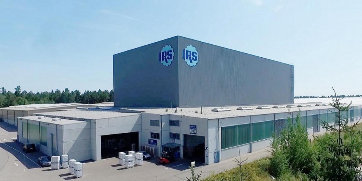 Frontal view of Rettenmaier's logistics center, viastore high-bay warehouse in the center