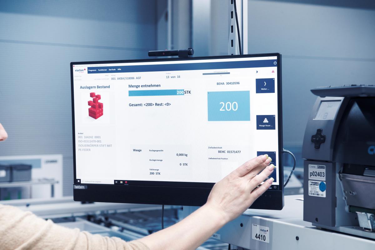 Warehouse employee operates screen with viadat warehouse management system from viastore